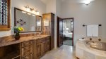 Primary bathroom features jacuzzi tub and separate shower
